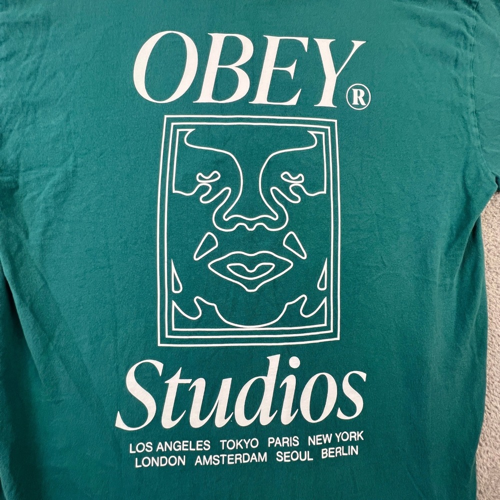 Obey Studios Mens Medium Graphic T-Shirt‎ Teal Green Short Sleeve Crewneck